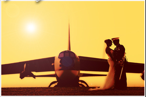 A bride and groom in front of an airplane